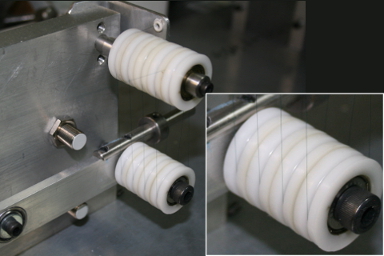 An image with inset showing a closeup of a wheel with thin catheter wire